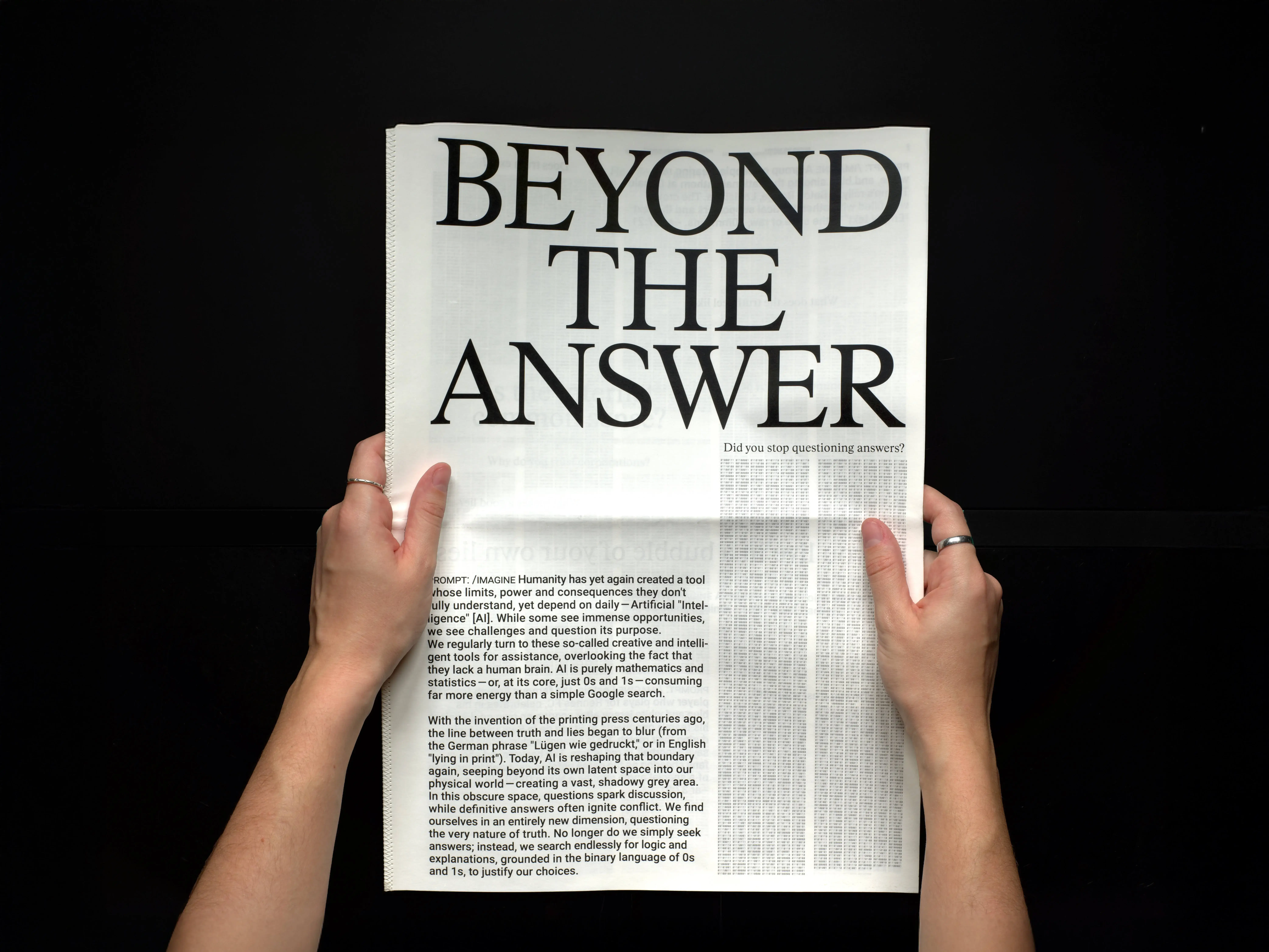 hands holding a newspaper with the title: Beyond the Answer