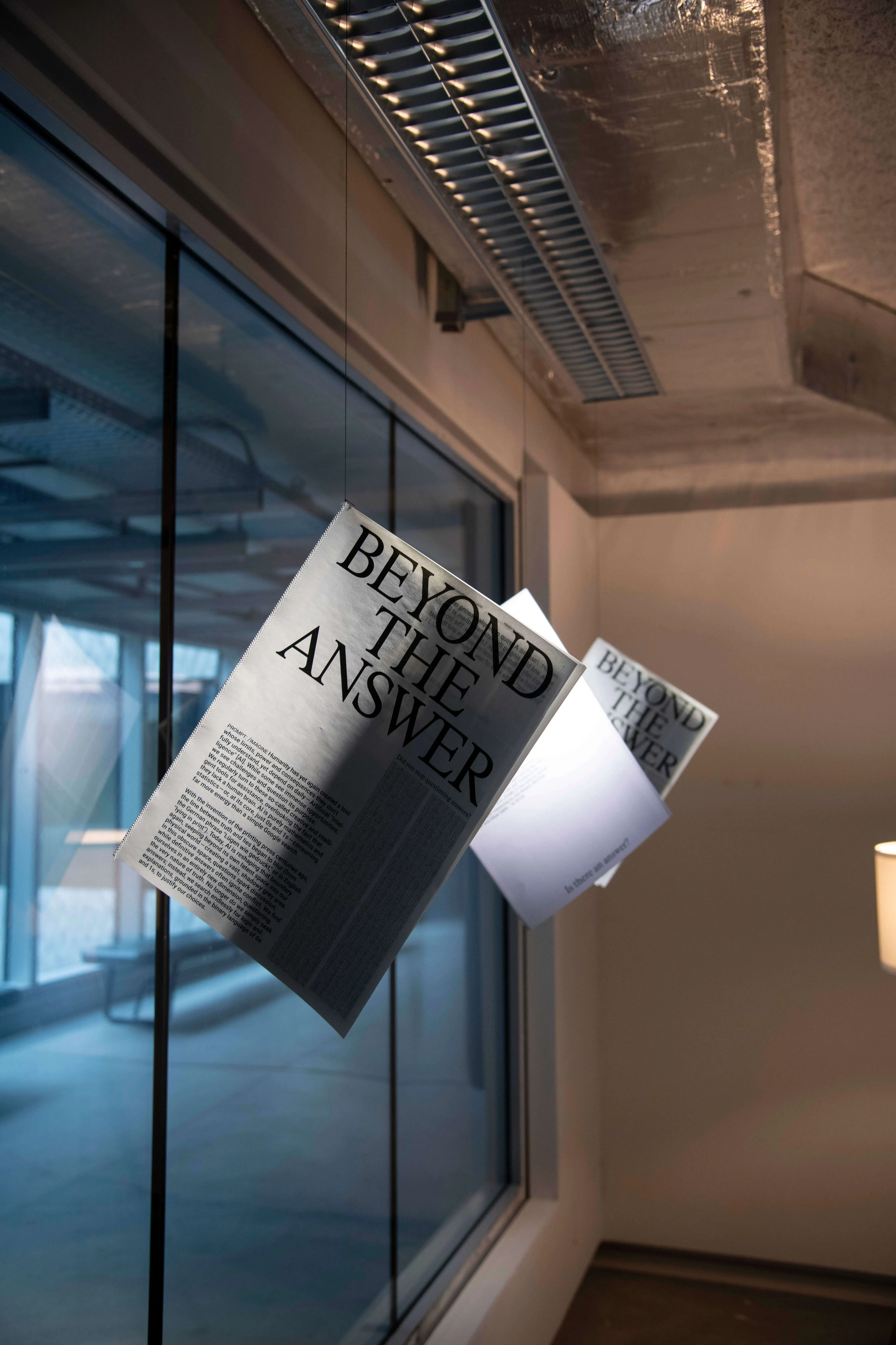 newspaper hanging from wall, floating in a warm room light ambiance